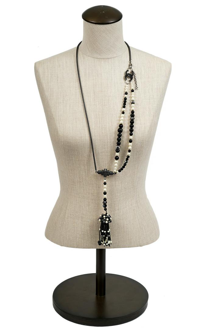 Chanel Gunmetal Black Bead & Faux Pearl Necklace: A statement piece, this Chanel necklace is in gunmetal colored silver with black beads and faux pearls. Dangling from one side is a large beaded tassel. There are two charms with black enamel beads. O
