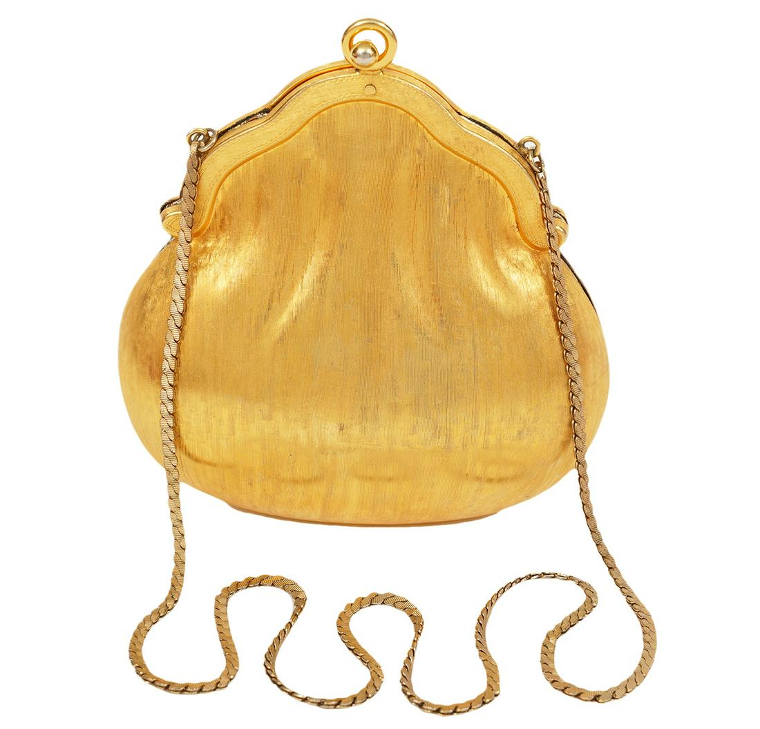 Judith Leiber 1967 Gold Metal Chatelaine Bag: Judith Leiber brushed gold metal Chatelaine bag in a shell inspired silhouette. Comes with thin gold shoulder chain and gold leather interior. Signed Judith Leiber. Measures 5"H x 5"W x 2.25"W. Condit