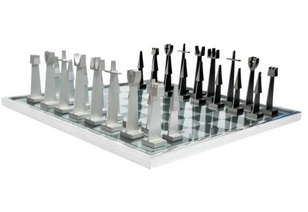 Austin E. Cox Aluminum Chess Set: Austin E. Cox aluminum chess set for Austin Enterprises, manufactured by Alcoa Aluminum Co. White chess pieces are natural aluminum, black are anodized. Marked on bases Austin Enterprises 1962. Board