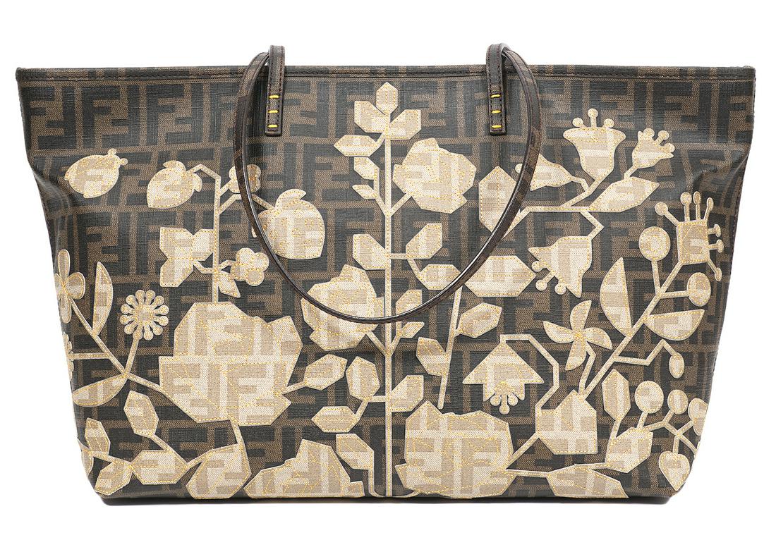 Fendi Zucca Spalmati Roll Tote Bag Limited Edition: Limited Edition Fendi Roll tote in tobacco Zucca Spalmati. Lined in golden yellow fabric with a zipper pocket and 2 slip pockets inside. 15"L x 11"H x 6"L, 9.5" strap drop. Made in Italy. CA15999XXX. 