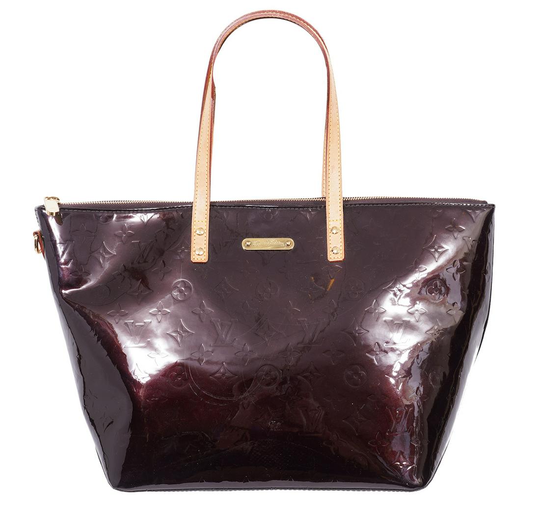 Louis Vuitton Amaranth Vernis Bellevue Tote: Louis Vuitton Amaranth Vernis Belleveu tote bag with vachetta hand straps. Lined in tonal fabric with 2 slip pockets inside. 11"L x 10.5"H x 7"W, strap drop 7". Date code is illegible. Made in France.