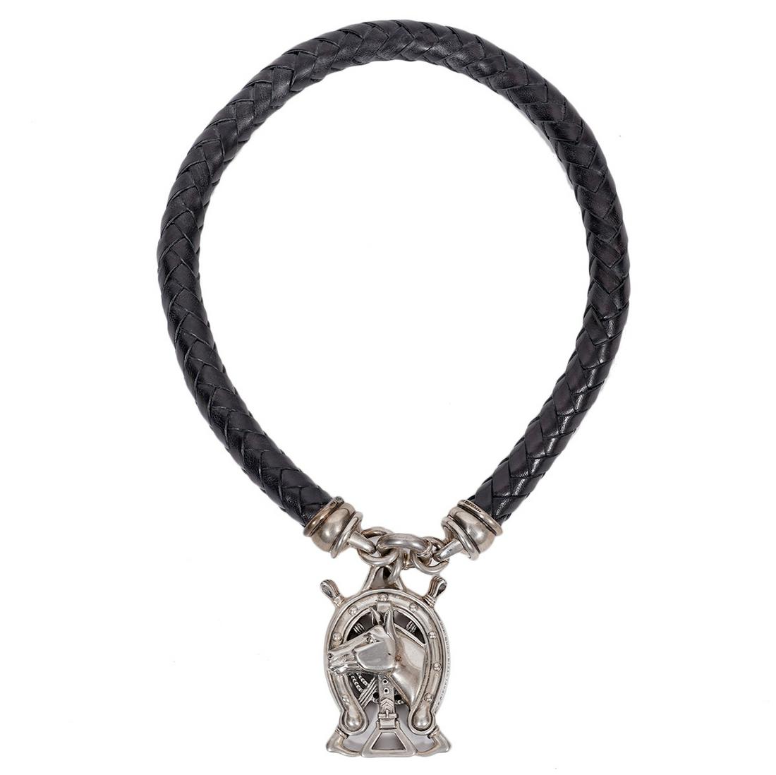 Kieselstein-Cord Leather & Sterling Horse Necklace: Kieselstein-Cord braided frog leather necklace featuring sterling silver end caps and equestrian pendant. signed and hallmarked. 1992. Leather 16"L, pendant 2"L. Pendant Weight: 42.8 grams. Includes: 