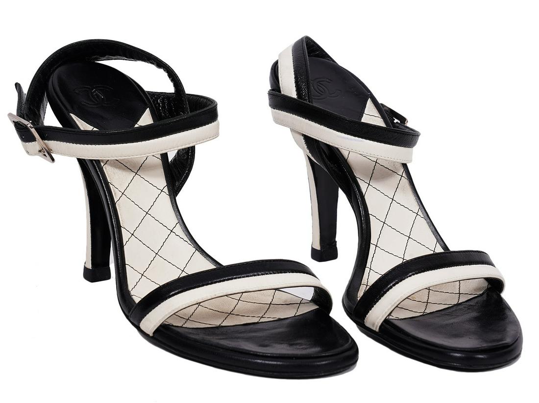 Chanel Black & White Strappy Heels Size 36: Chanel black and white stripy heels featuring a buckled ankle strap. Size 36. Heel height: 4". Made in Italy. Condition grade: 2. Examine all photos closely. Contact AAG for more detailed information 