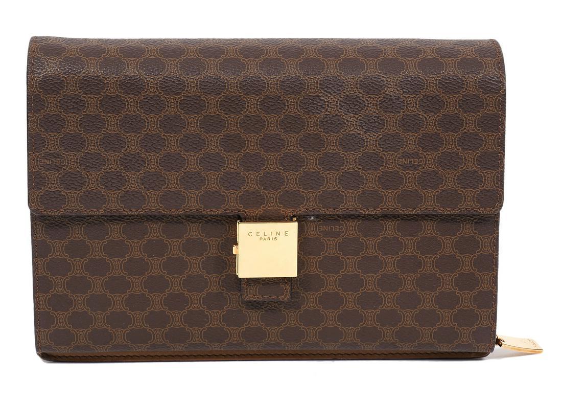 Celine Brown Macadam Clutch Wallet: Celine brown Macadam PVC clutch and wallet. The front of the clutch has a zipper pocket that opens up into a wallet with multiple pockets and 6 credit card slots. 9.25"L x 6.25"H x 2"W. Made in Italy.