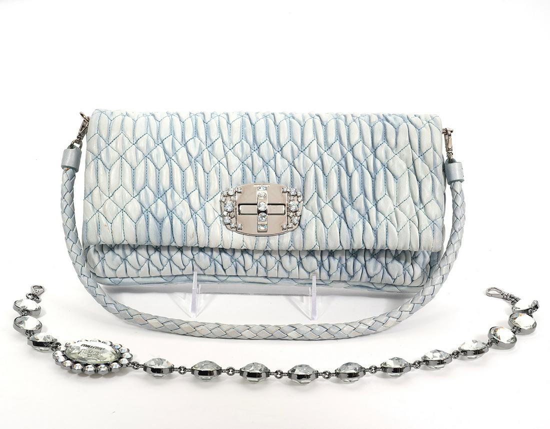Miu Miu Distressed Blue Matelasse Quilted Bag: Miu Miu distressed light blue Matelasse quilted leather shoulder bag with polished silver crystals clasp and 2 detachable straps. One of the straps is braided matching blue leather and the other is a 