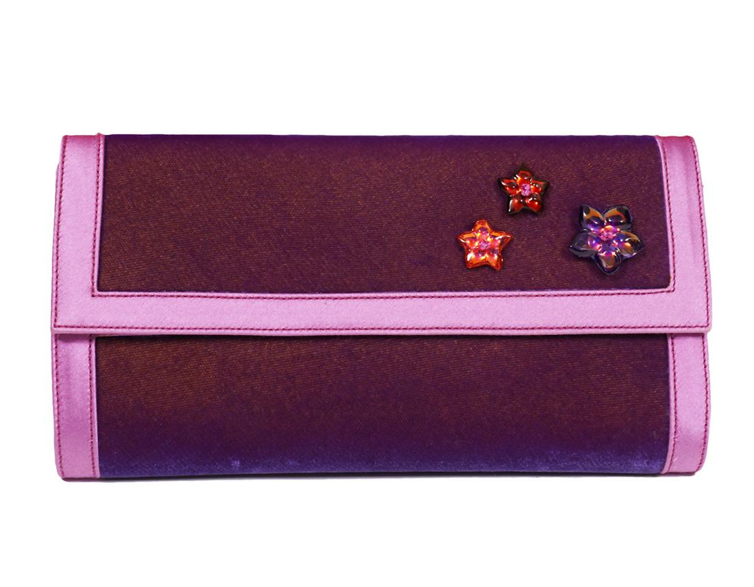 Baccarat Blossom Pink Velvet Clutch: Baccarat purple velvet clutch featuring blossom pink satin trim and lining, adorned with lead crystal flowers. 1 slip pocket inside. Hidden magnetic closure. 8.25"L x 4.25"H x 1.5"W. Made in France. I
