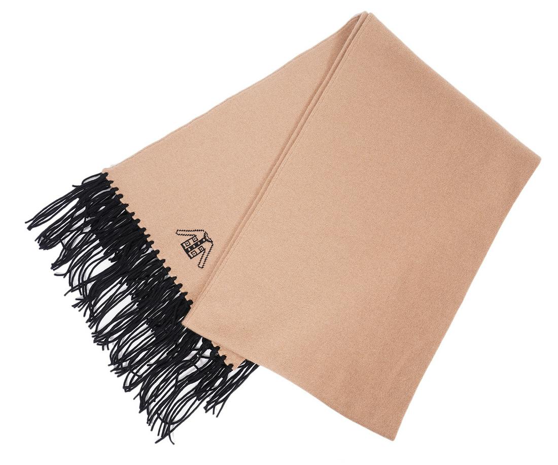 Chanel Camel Cashmere Scarf Black Fringe: Chanel camel cashmere scarf with black fringe. One end of the scarf boasts a Chanel jacket and the other end has an iconic Chanel flap bag with a crystal encrusted CC accent. 72"L x 13"W. Condition gr