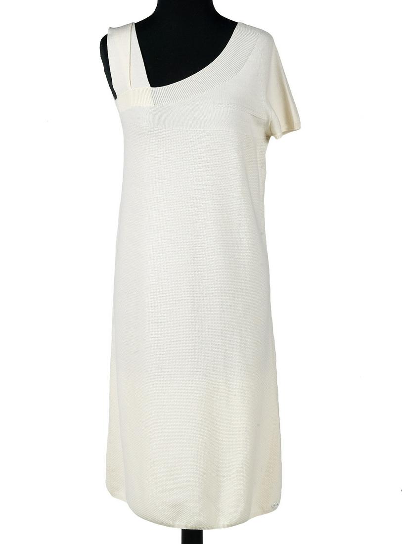 Chanel Cream Knit One Sleeve Dress Size 40: Chanel 2007 white soft woven textured wool sweater sheath with one sleeve. Comes with Chanel CC flocked hanger, size 40. Measures bust 34"; hip 38"; length from shoulder 39".Condition grade: 2. Examin