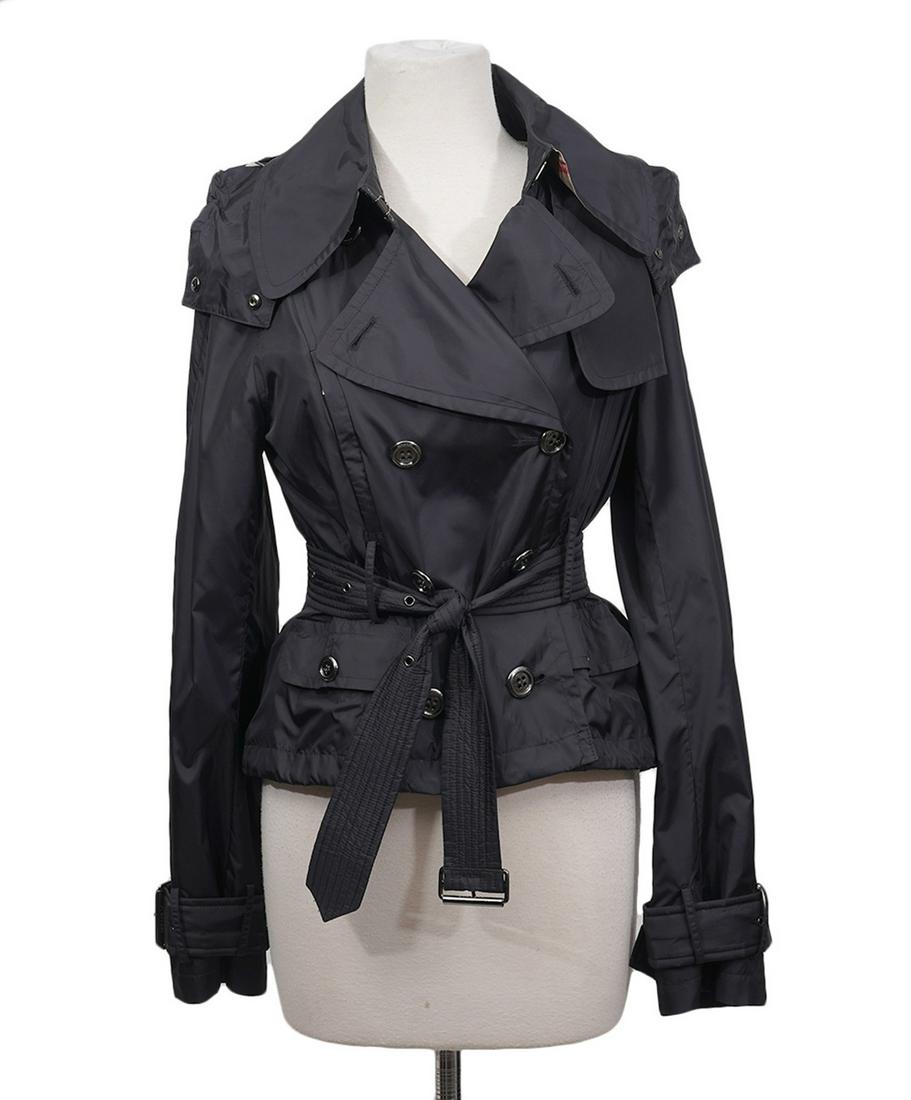 Burberry Black Nova Check Rain Jacket Size 6: Burberry black rain coat / wind breaker with belted waist and sleeves. Partially lined in Nova Check. Detachable hood. Size 6. Bust Length from shoulder. Condition grade: 1. Examine all photos closely
