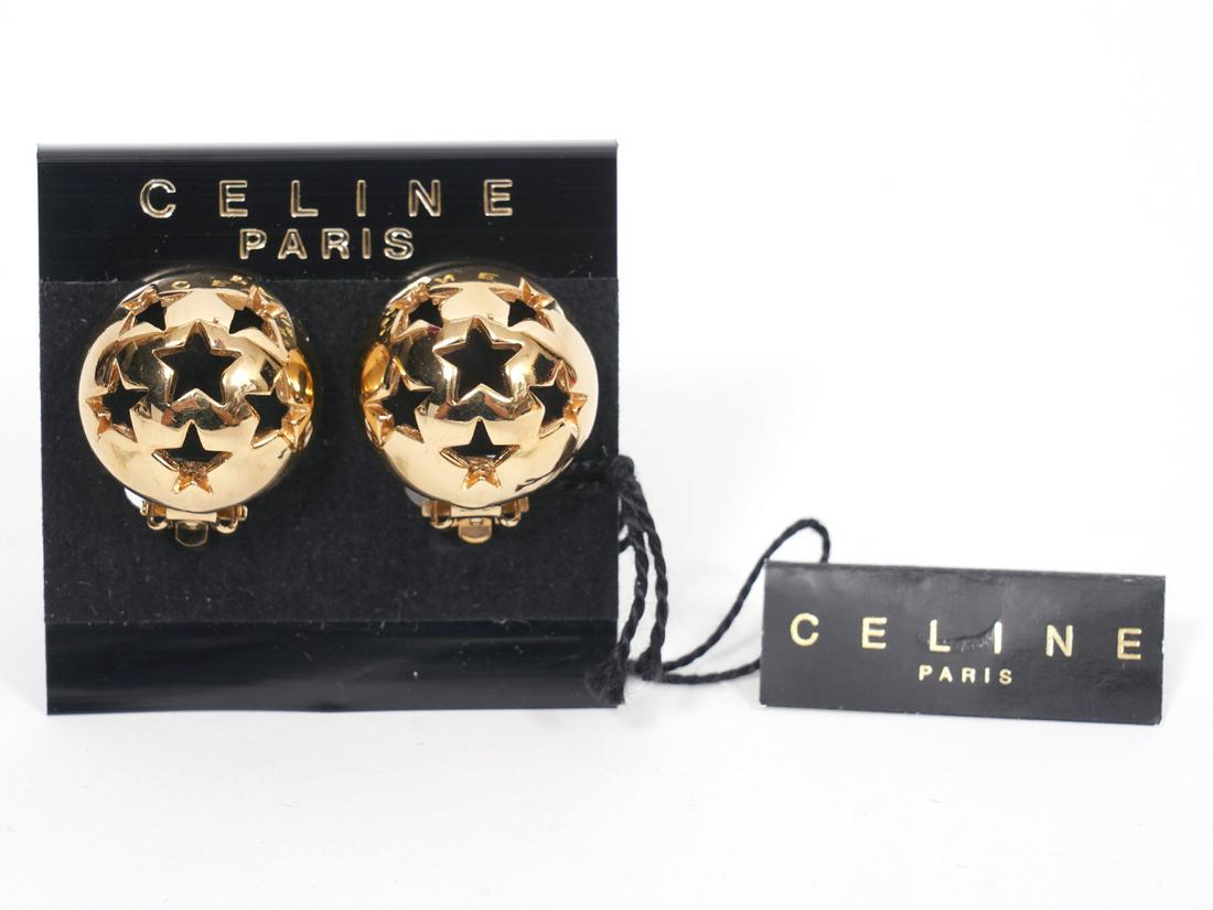 Celine Open Star Button Clip On Earrings Italy NEW: Celine gold tone button earrings with pierced stars. Clip on. .75" diameter. Condition grade: 1. New with tags. Examine all photos closely. Made in Italy. Contact AAG for more detailed information if