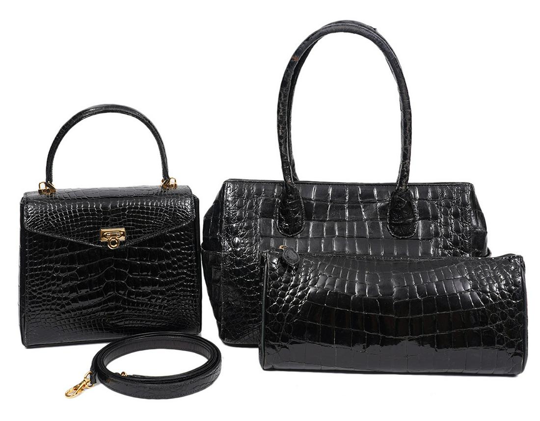 3 Eileen Kramer Vintage Genuine Croc Handbags: 3 Eileen Kramer vintage hand bags in genuine black crocodile: a flap bag with gold hardware 8.5"L x 7"H x 3"W, strap drop 4"- condition grade: 1, a rolled handled tote with snap closure 11.5"L x 7.75"