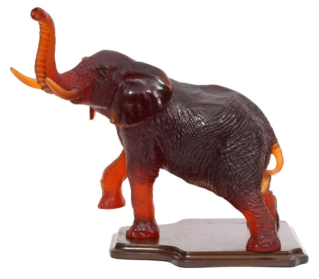 Daum France Crystal Pate de Verre Elephant: Daum amber crystal elephant with trunk up, by Jean-Francois Leroy for Daum. Signed Daum France and Leroy on legs. Measures 13.5"H x 15.5"L x 8.25"W. Condition report: good condition, no issues, see ph