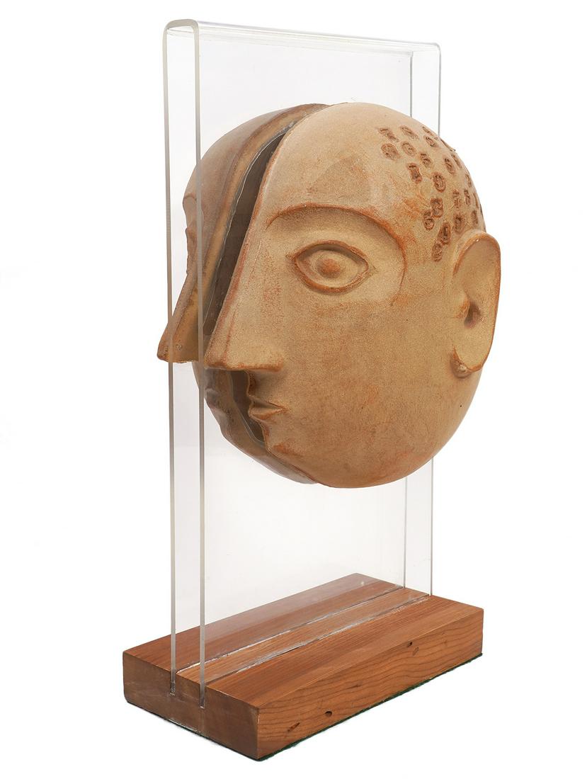 Split Head Stoneware Sculpture by David Gil: Split head stoneware sculpture by David Gil (American, 1922-2002) for Bennington Potters. Each side of the head is attached to a piece of clear lucite and mounted on a wood base. Measures 19"H x 10"W