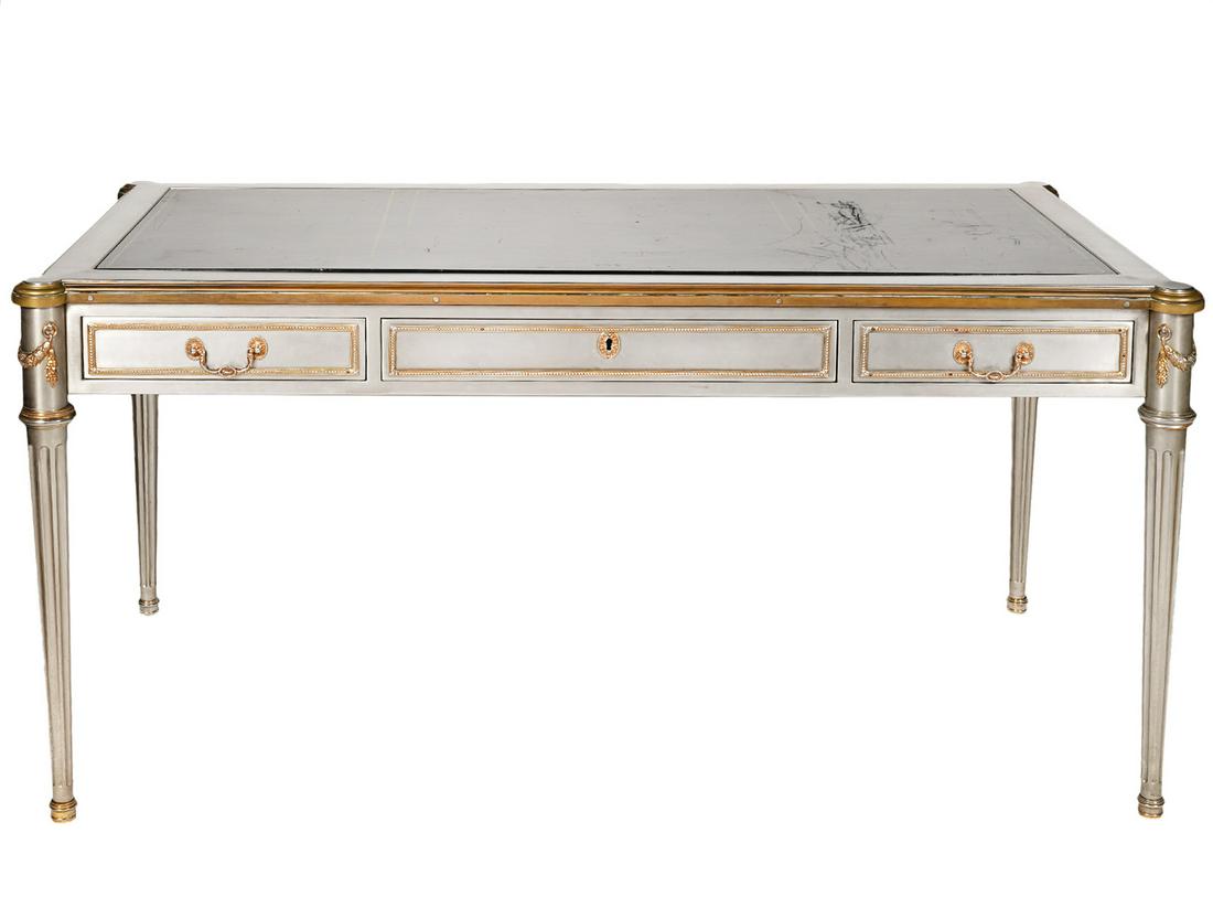 John Vesey Steel & Gilt Bronze Neoclassical Desk: John Vesey, American (1924-1992). Stainless steel and gilt bronze bureau plat, neoclassical French Louis XVI style. Fluted column supports decorated with gilt acanthus swags and gilt bronze mounts and