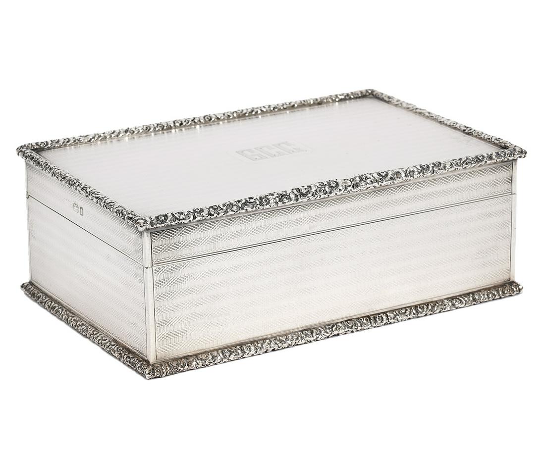 George V English Antique Sterling Silver Box: Antique sterling silver George V English box made by William Frederick Wright in London in 1926. Top and sides have overall engine turned wave design and edges have tooled floral rims, hallmarks on si