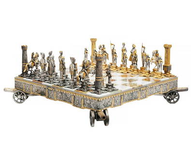 La Bottega del Vasari Hand Chiseled Chess Set: Italian chess set with hand chiseled bronze pieces finished in silver and 24K yellow gold, on onyx board supported by bronze canons on each corner. Designed by Gianni Inclimona, who founded La Bottega