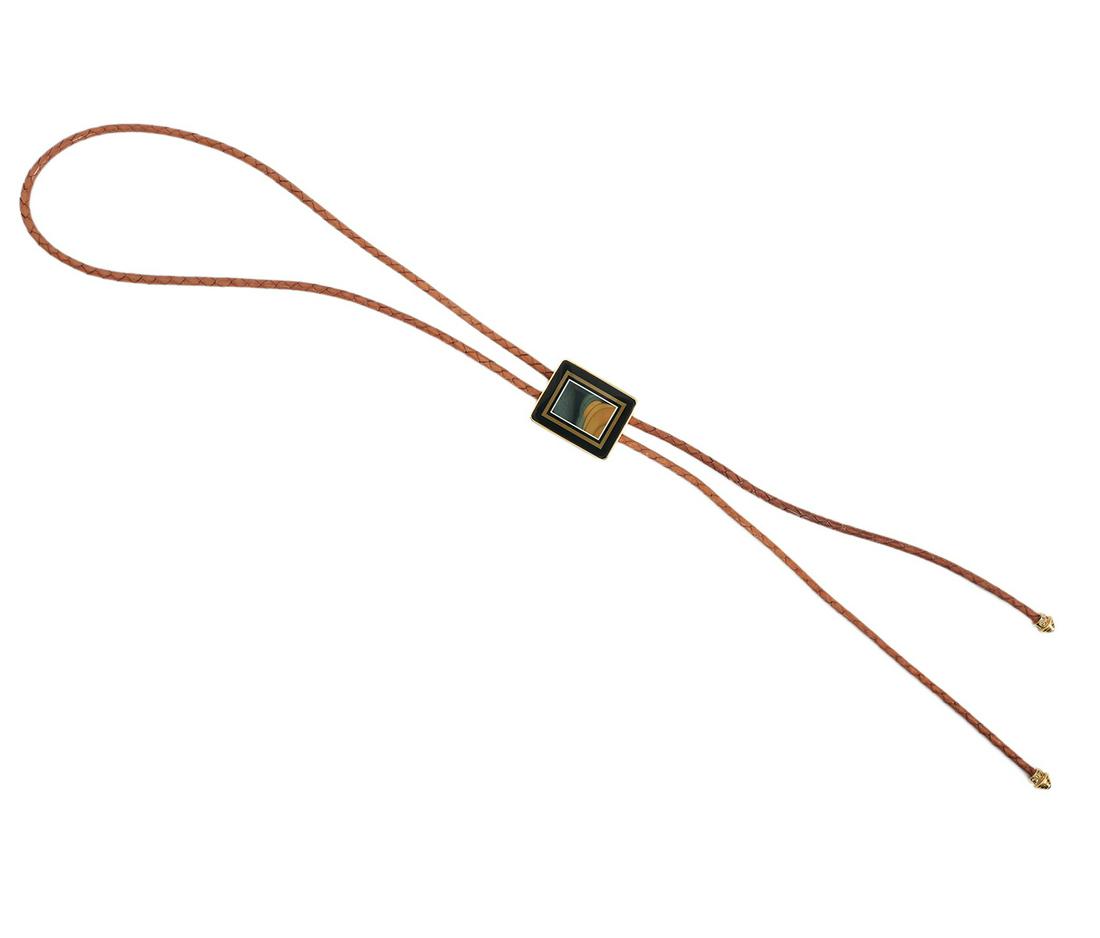 18K YG Bolo Tie w/ Gem Stones & 14K Tips: 18K yellow gold Intarsia Bolo Tie on brown leather cord has Morrisonite with black onyx, black jade and tan Jasper with Granite backing, gold security latch on verso. 14K yellow gold tips adorned with