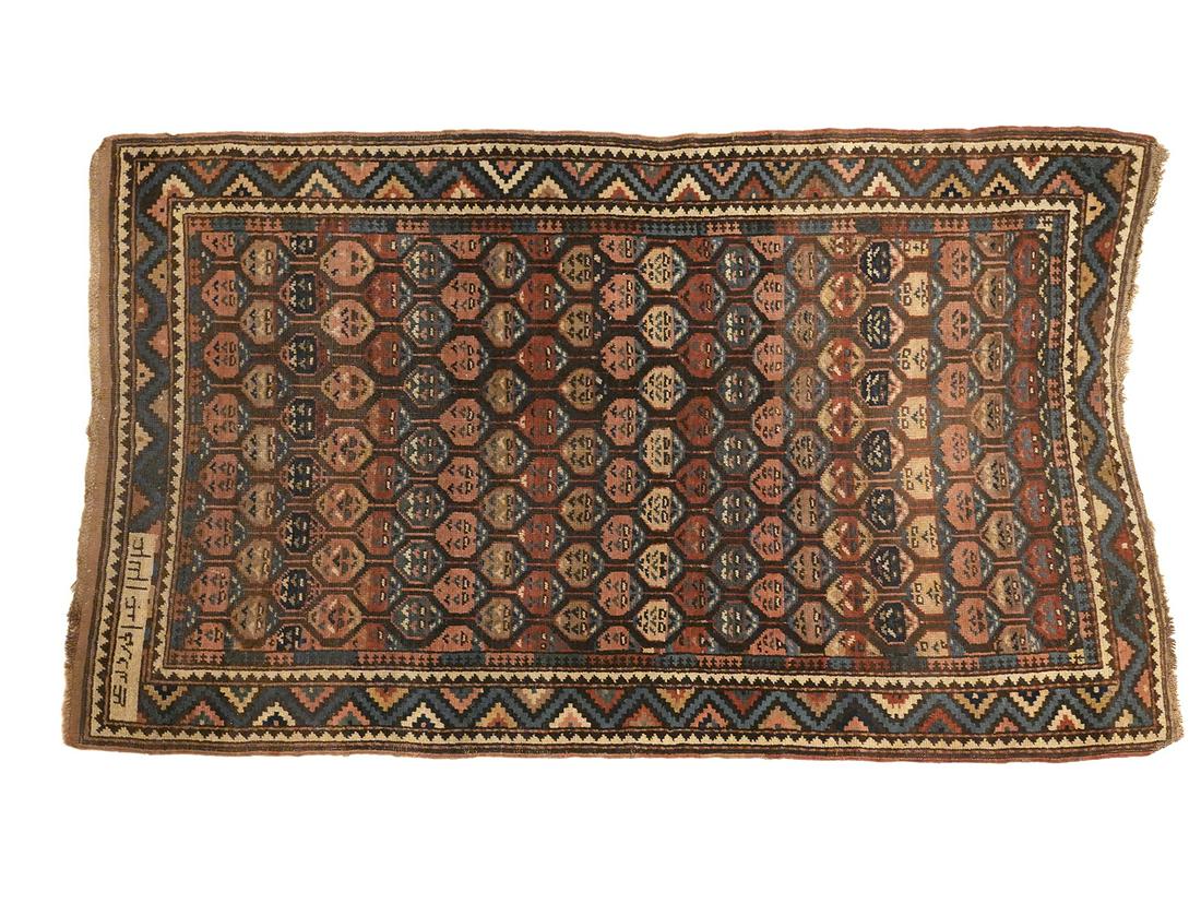 Antique Caucasian Rug: Antique Caucasian Rug originating from the area of Caucasus, a mountain region bordering Persia and Turkey. Best known for their bold contrasting colors and shading techniques. Measures 68"L x 40"W. C