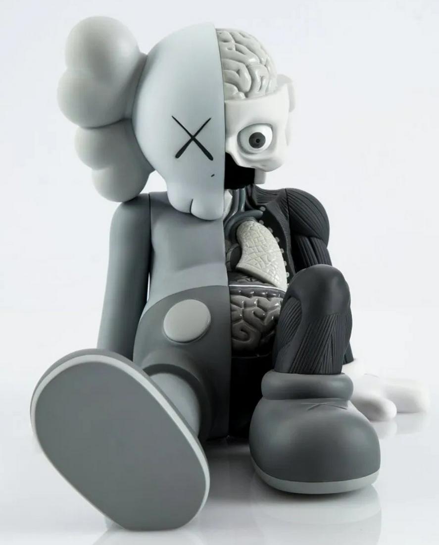 KAWS 'Resting Place' Companion in Grey 1st Edition: KAWS Resting Place Companion in grey painted cast vinyl, comes with original packaging and box, released in 2013. Each of the three colors that it comes in are limited editions of 500. Measures approx