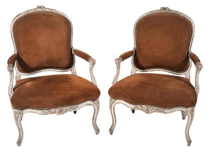 Pr. Louis Delanois 18th C. French Fauteuil Arm Chairs: Pair of Louis Delanois French 18th C. fauteuil arm chairs, carved and painted, with suede upholstered arm rests, seats and backs all bordered with nail heads. Carved and painted wood frame with