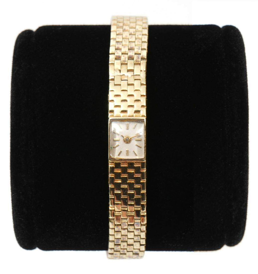 Tiffany & Co. Backwind Lady's 14K Wrist Watch: The 1960's vintage 14K yellow gold backwinding lady's wrist watch was made for Tiffany & Co. and is signed 'Tiffany & Co. France' on the case with integral brickwork link bracelet. 27.9 grams. The wat