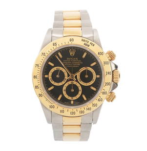 Rolex Daytona Cosmograph Chronograph Wristwatch: 1993 steel and 18K yellow gold gentleman's Rolex Daytona Cosmograph chronograph wristwatch Reference 16523, original black dial with gold accents. This watch has the steel and 18K yellow gold referenc