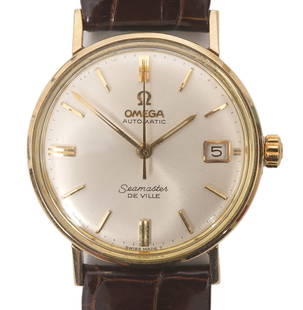 Vintage Omega Seamaster De Ville Watch: Mid 1960's Omega De Ville steel and gold automatic wristwatch with date aperture at 3:00. This model has the mono block solid case and is engraved with a 25 year service inscription dated 1966. The wa