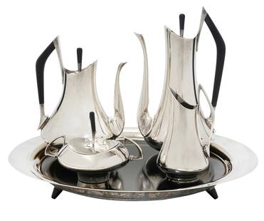 Gorham Sterling 'Circa 70' Tea & Coffee Set: Gorham sterling 'Circa 70' tea and coffee set designed by Donald Colflesh, accented with ebony handles and finials. Tea Pot (9.5"H x 7"L x 6.25"W, weighs 894 grams); Coffee Pot (11.75"H x 6"L x 5.5"W,