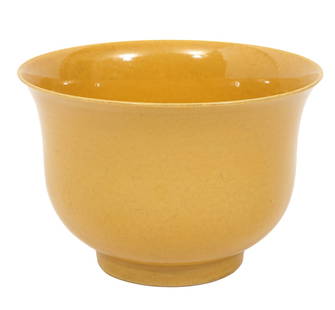 Chinese Yellow Glazed Porcelain Bowl: Chinese yellow glazed porcelain footed bowl with flared rim and circular straight foot. 2 rings and 6 character marks incised on bottom. Measures 4"H x 6"W. Condition report: good condition, no