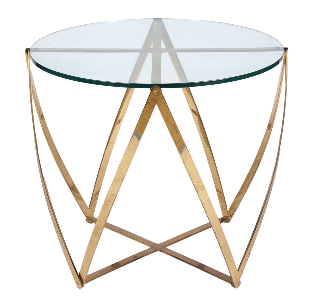 John Vesey Mid-Century Brass & Glass Table: John Vesey mid-century sculptural table has an inset circular glass top on brass strap designed base. Glass top measures 24"W x .5" thick; table 25.5"H x 24.5"W. Condition: good condition, please see