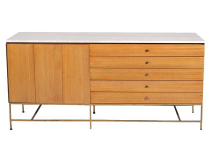 Paul McCobb for Calvin Travertine Top Credenza: Paul McCobb for Calvin Furniture travertine top credenza or sideboard. 'The Irwin Collection'. Brass legs with travertine top. Labeled on the inside. Measures 34.5" H x 19" D x 71.25" W. Condition