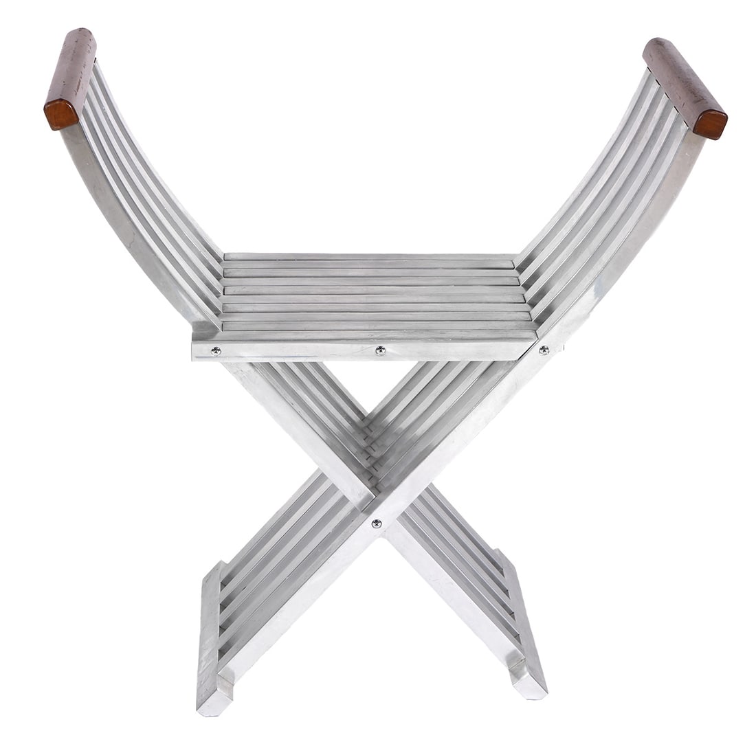 John Vesey Aluminum Folding Bench: Classic John Vesey aluminum folding bench with walnut arms. Measures 28" H x 27" W x 11.75"D. Condition: overall good condition with normal wear as seen in photos. Contact AAG for more detailed inform