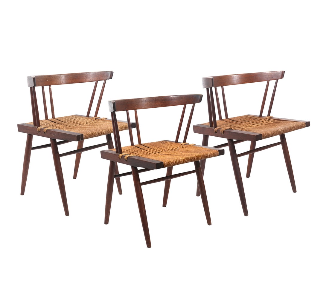 Set of 3 Grass-Seated Chairs by George Nakashima: George Nakashima (1905-1990). Set of 3 walnut grass-seated chairs. Chairs are unmarked. Walnut and woven seagrass. *We do guarantee the authenticity of these chairs. Measure approx. 26.5 h x 23.5 w x