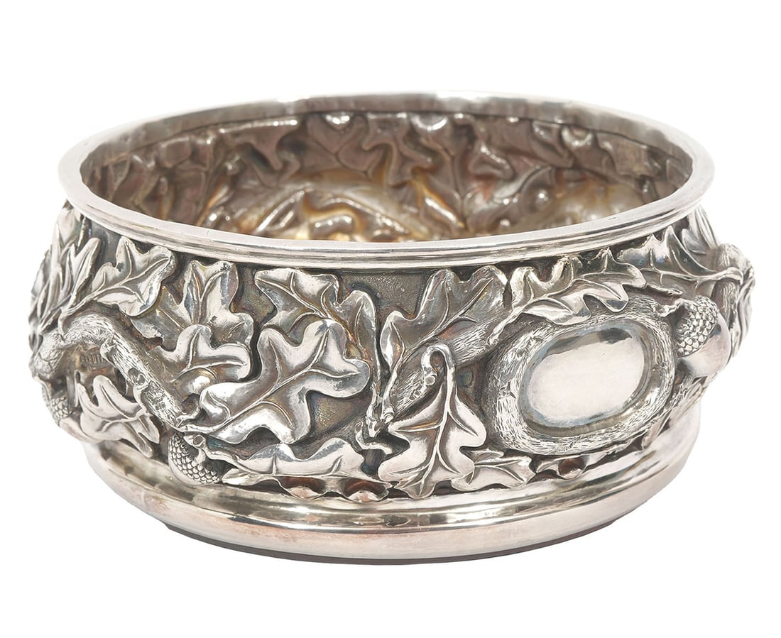 Robert Butler Silver 'Oak Leaf & Acorn' Coaster: Robert Butler, American (20/21st Century). 'Oak Leaf and Acorns' sterling silver wine coaster with hardwood bottom, fully hallmarked. Weighs 424 total grams. Measures 5.5" W x 2.5" H. Condition: good