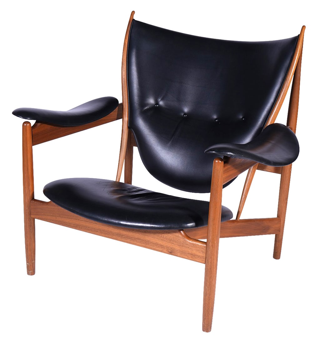 House of Finn Juhl 'Chieftain Chair': Chieftain Chair' by House of Finn Juhl upholstered by hand in Demark in black leather with walnut frame. Label on underside and inscribed in wood. Measures 33.5"H x 29.25"W back; 39.4"W arm to arm; 13