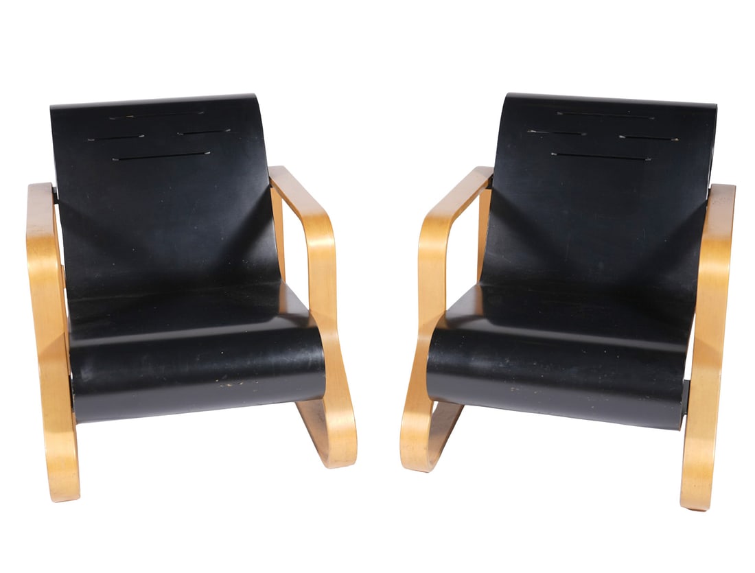 Pair Alvar Aalto Paimio #41 Scoll Chairs: Alvar Aalto, Finland (1898-1976). Pair of Paimio #41 Scoll Chairs designed in 1941 by Alvar Aalto for Artek of Finland. The chairs have laminated natural birch legs bent into a closed curve and suppor