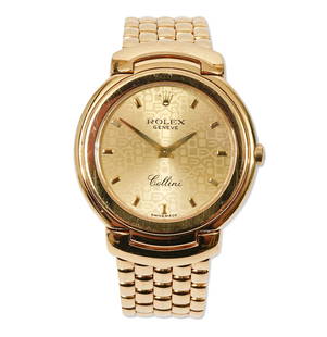 Rolex Cellini 18K YG Men's Wristwatch: Rolex 18K yellow gold Cellini Ref. 6622 has the original signed Rolex 18K yellow gold integral bracelet with hidden clasp. The 33mm watch has the original signed Rolex Caliber 6620 8 jewel quartz move