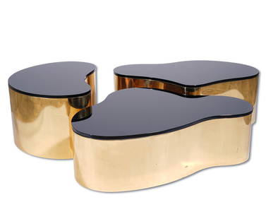 3 Karl Springer Freeform Coffee Tables: 3 Karl Springer freeform amorphic shaped coffee tables with welded seamless brass around the bases and .75" thick reverse painted black glass tops. Tables measure 49"L x 32"W x 15"H; 47.5"L x 26.75"W