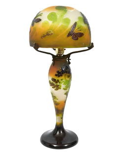 Emile Galle Cameo Signed Glass Table Lamp: Emile Galle, France (1846-1904). Emile Galle French Art Nouveau cameo glass table lamp with a raised signature near the base. Decorated with tall full trees in the background. The top has a three arm
