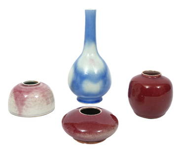 Group of Four Chinese Porcelain Pieces: Four Chinese porcelain pieces includes an oxblood glazed brush washer, unmarked (2.25"H x 4.25"W); an oxblood glazed small vase, unmarked (4"H x 3.75"W); peach bloom glazed beehive water pot with 6 Ch