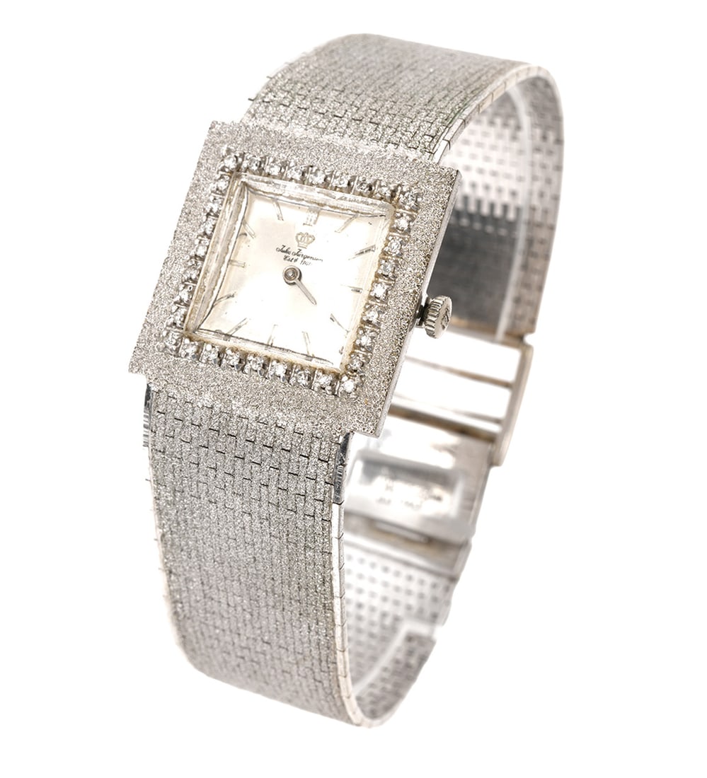 Jurgensen 14K Man's Wristwatch Diamond Bezel: Jules Jurgensen 1950's vintage 14K white gold man's dress wristwatch with 14K white gold Florentine finish integral bracelet and diamond bezel. The watch has a square crystal and is bordered with 32 a