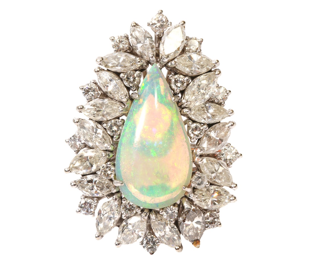 Lady's Opal & Diamond 14K WG Cocktail Ring: Lady's opal and diamond 14K white gold cocktail cluster ring features a central pear shaped opal (measuring approximately 19.7mm x 10.4mm, 6-7 cts) highlighting vivid blue and green colors surrounded