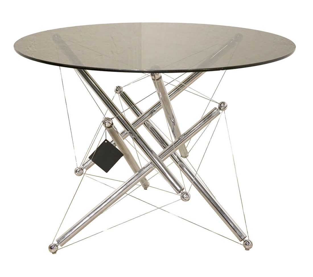Theodore Waddell for Cassina Chrome Tension Table: Theodore Waddell designed this Chrome Tension Table 714 in 1973 for Cassina Mid-Century Modern who produced it in the 1980's. It has a chromed steel sculptural base using cables that act in a load bea