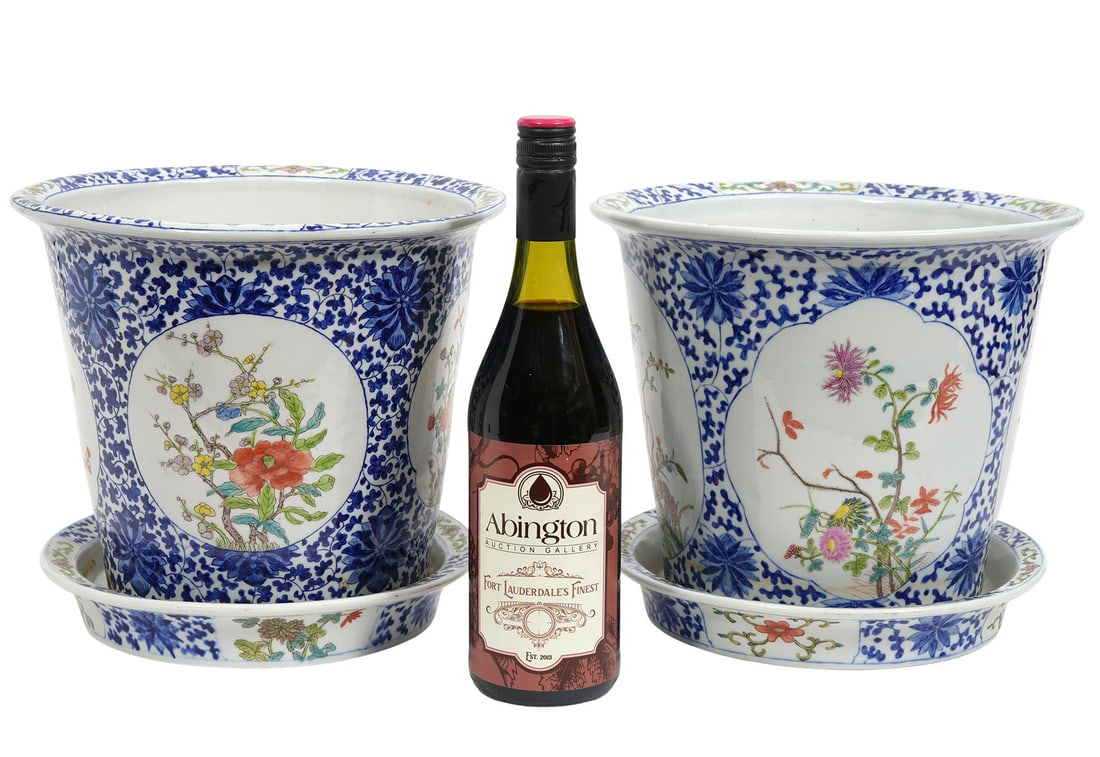 Pr. Chinese Porcelain Jardineires with Saucers: Pair of Chinese porcelain jardinieres and saucers/underplates, hand painted with classic blue and white floral pattern and colorful flowers inside circular medallions. Jardineires measure 9"H x