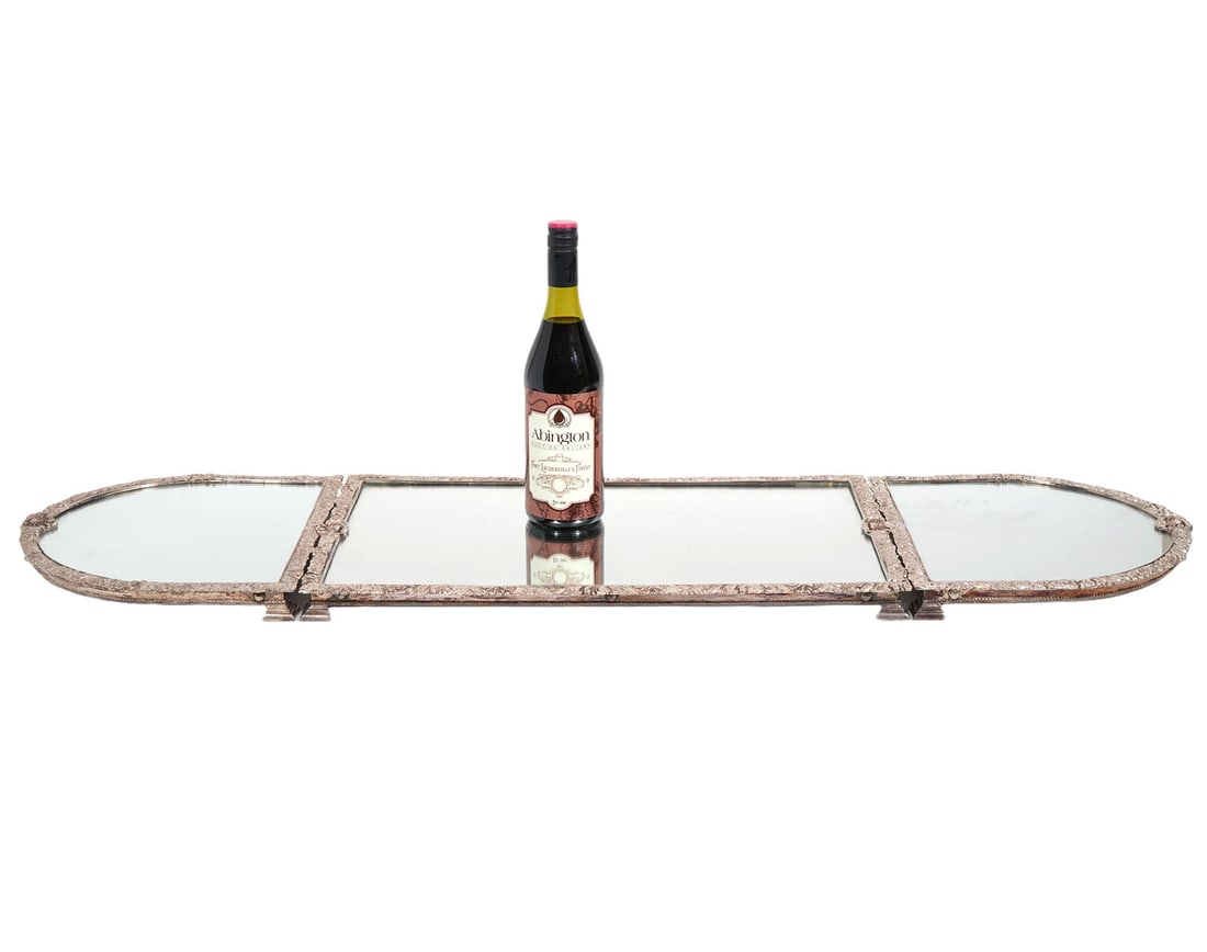 3 Pc. Silver Plated Mirrored Plateau Set: Three pieces of vintage silver plated mirrored plateau set includes two pieces that are each half oval shaped, raised on 3 feet and measure 11.5"L x 12 5/8"W x 1.25"H. Single rectangular piece measure