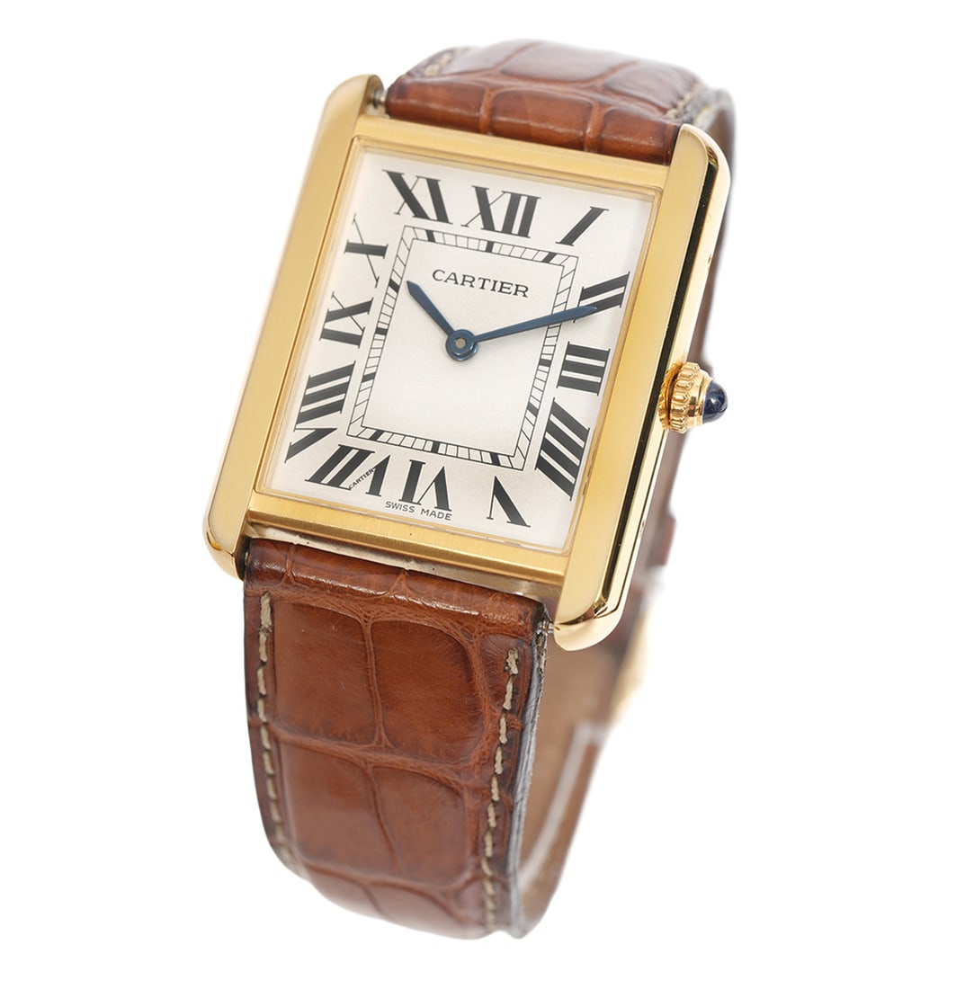 Cartier Tank Solo REF. 3167 18K Wristwatch: Cartier 18k yellow gold Tank Solo quartz wristwatch Ref. 3167 with original stainless steel back and original signed Cartier leather strap with 18k gold Cartier tang buckle. Large model 33.7 mm. The m