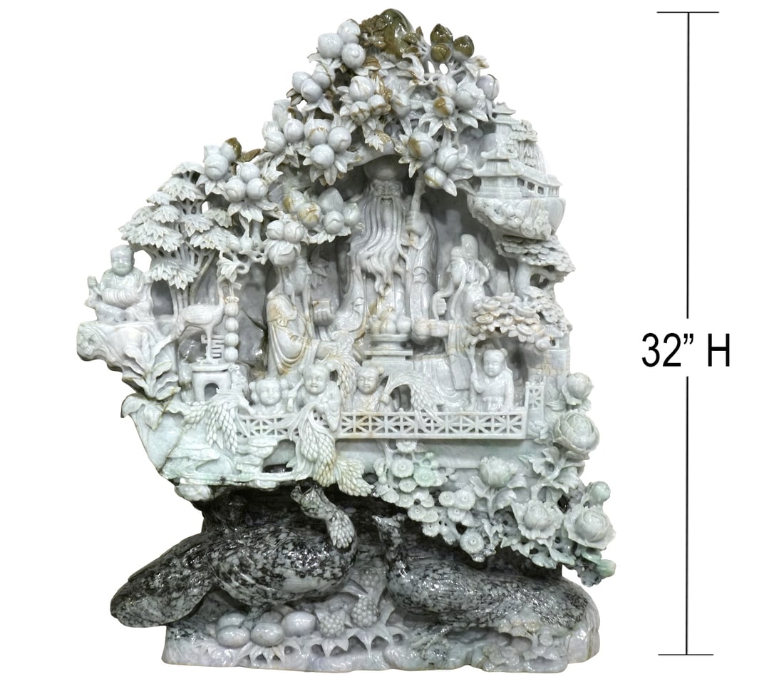 Monumental Carved Chinese Jade Sculpture: Chinese monumental intricately carved jade sculpture with two scholars seated at a table in the center surrounded by trees, fruits and flowers with 2 large peacocks at the base. Measures 32.5"H x 25"L