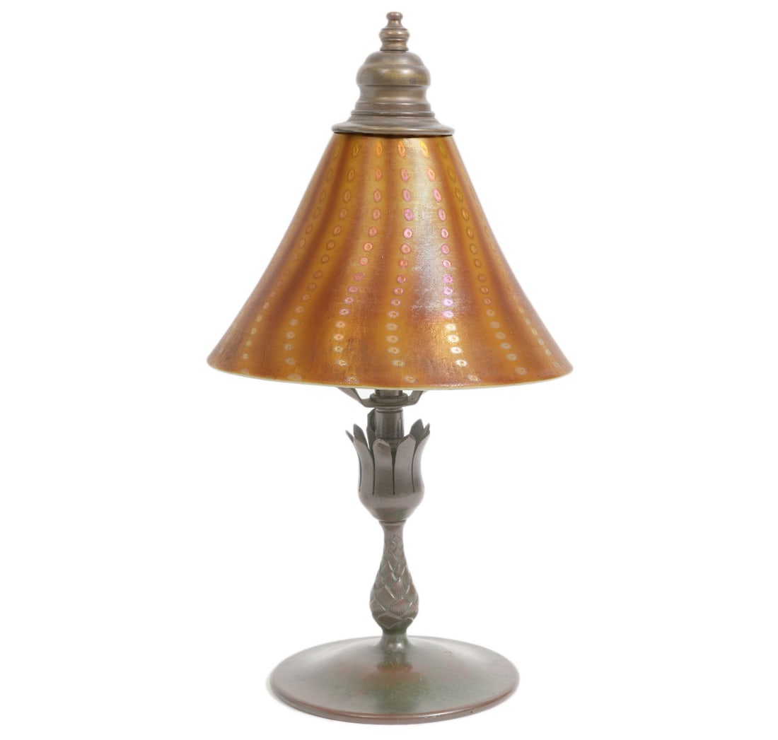 Tiffany Studios 'Arabian' Boudoir Lamp: Tiffany Studios 'Arabian' boudoir table lamp with cone shaped Favrille decorated glass shade over a single socket. The lamp has a tulip shaped base and circular bottom. Base is marked Tiffany Studios 