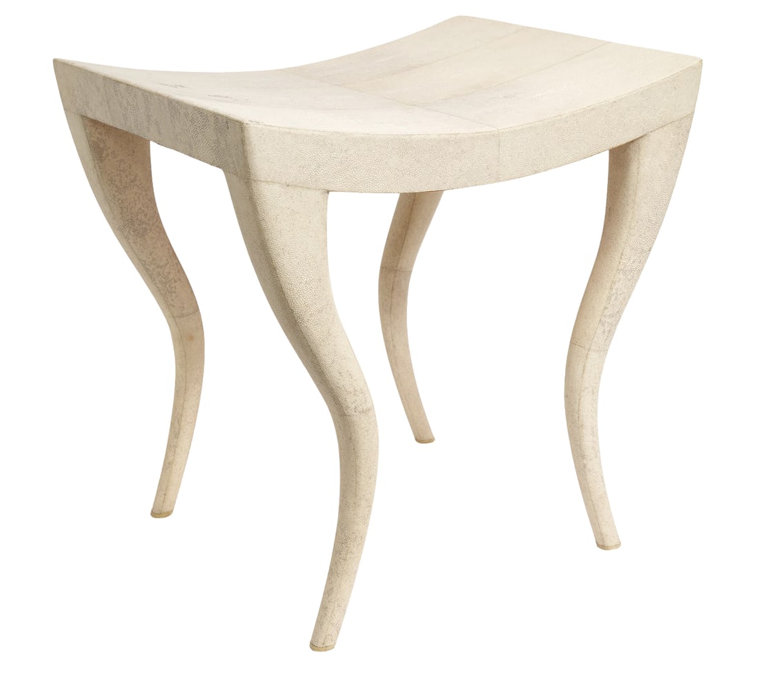R & Y Augousti Shagreen Stool: R & Y Augousti art deco inspired cream shagreen stool with saber legs and a bronze name plaque on underside. Measures 20"H x 19.75"L x 15.75"W. Condition: light surface wear, some loose pieces on unde