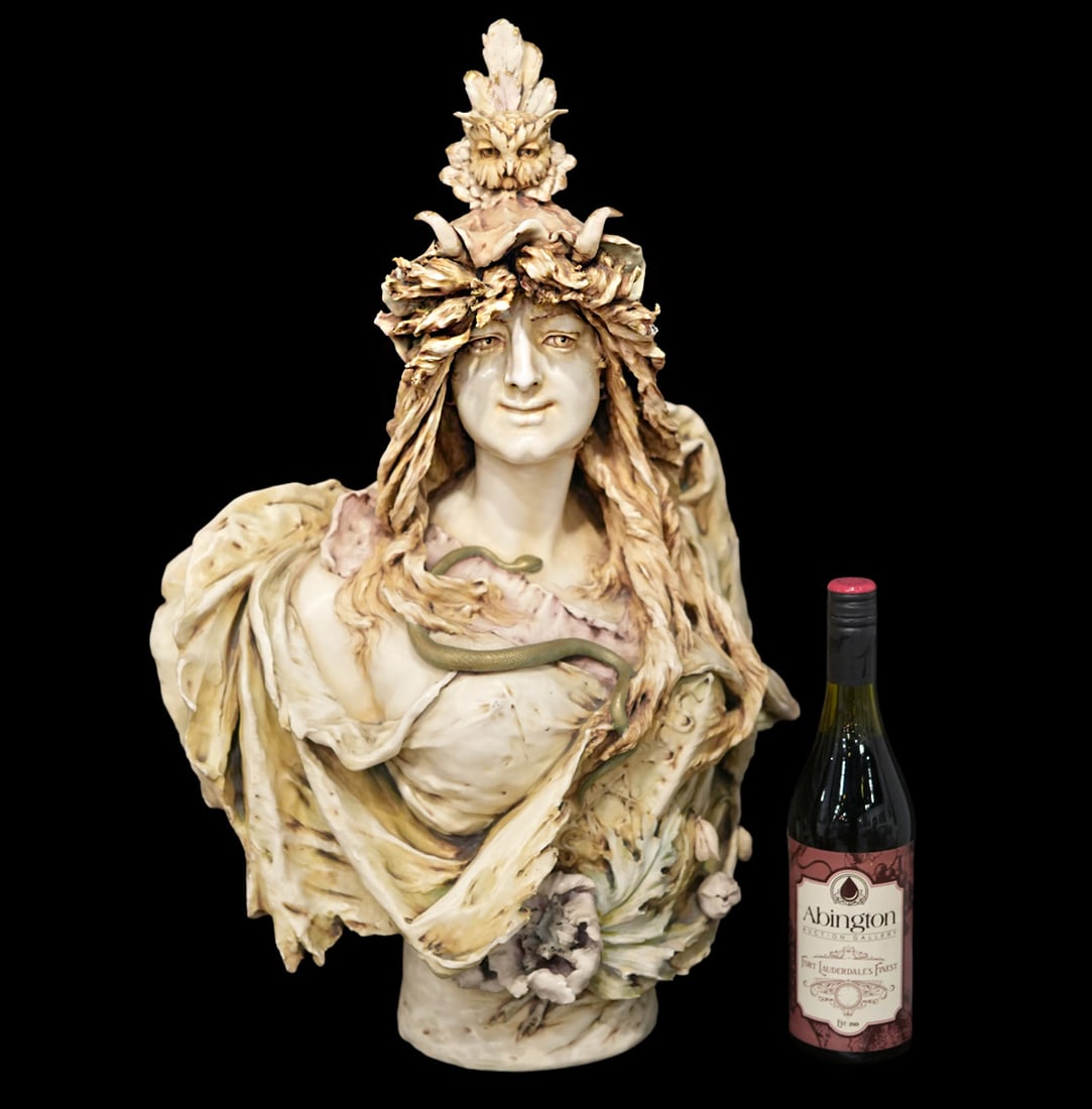 Ceramic Bust by Eduard Stellmacher for Amphora: Eduard Stellmacher, Germany (1868-1945). 20th C. Art Nouveau female bust 'Athena' features organic details and a floral wreath. Signed on back and has RStK stamp. Measures 24.5"H x 16.5"W x 8.5"D. Con